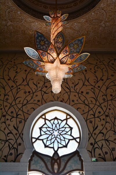 Intricate chandelier and window design inside the Sheikh Zayed Grand Mosque in Abu Dhabi.