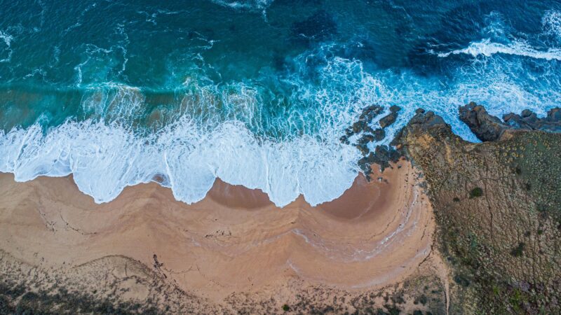 Aerial view of scenic San Remo beach at sunrise.