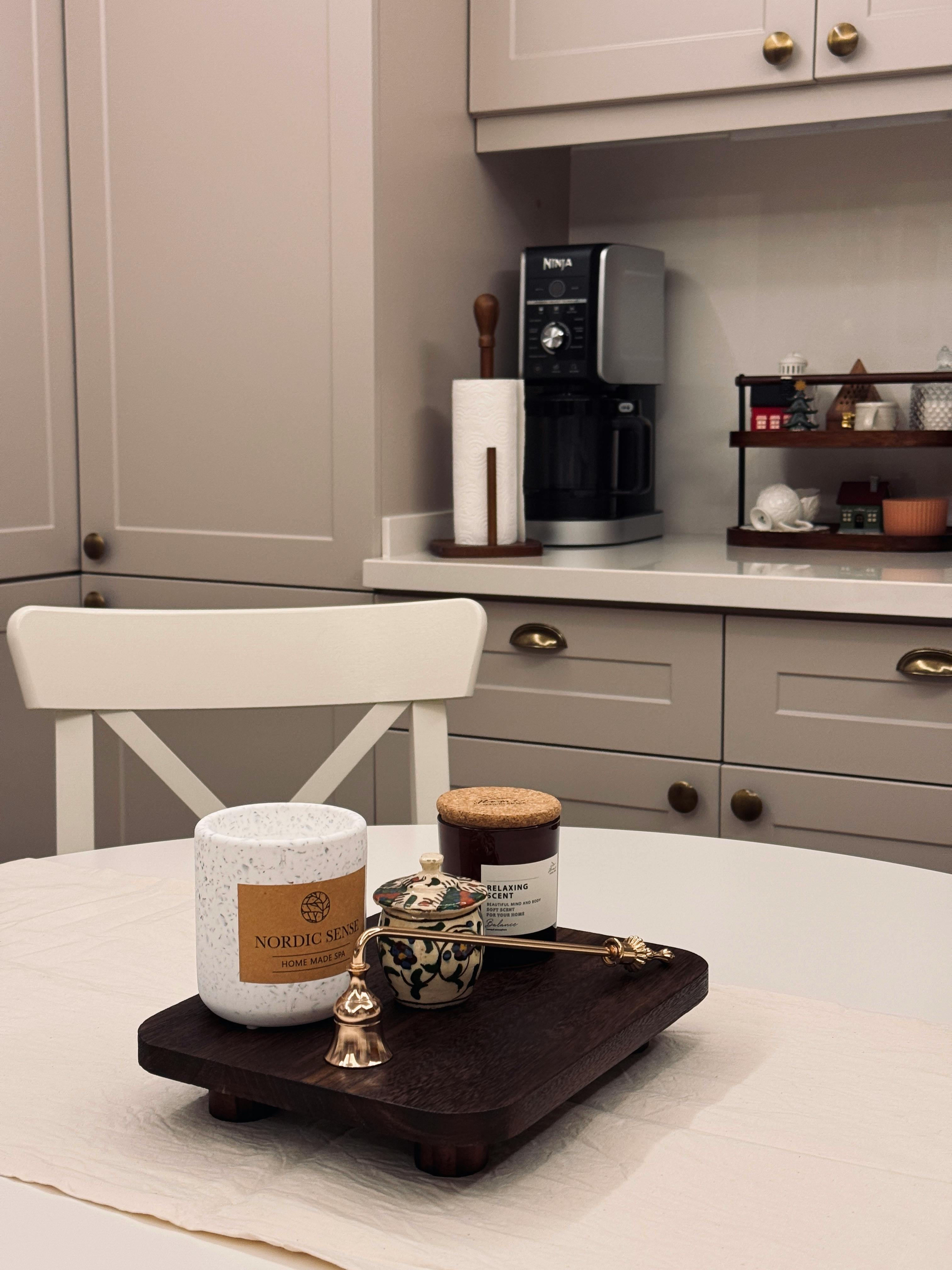 Warm kitchen with a coffee station and stylish decor items.