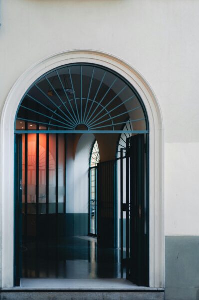 Elegant arched doorway with iron grill design.
