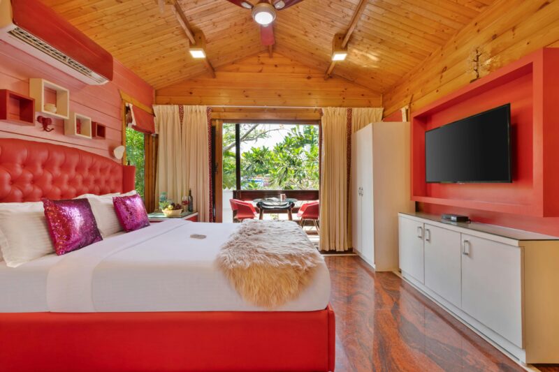 Luxury villa bedroom with red accents.