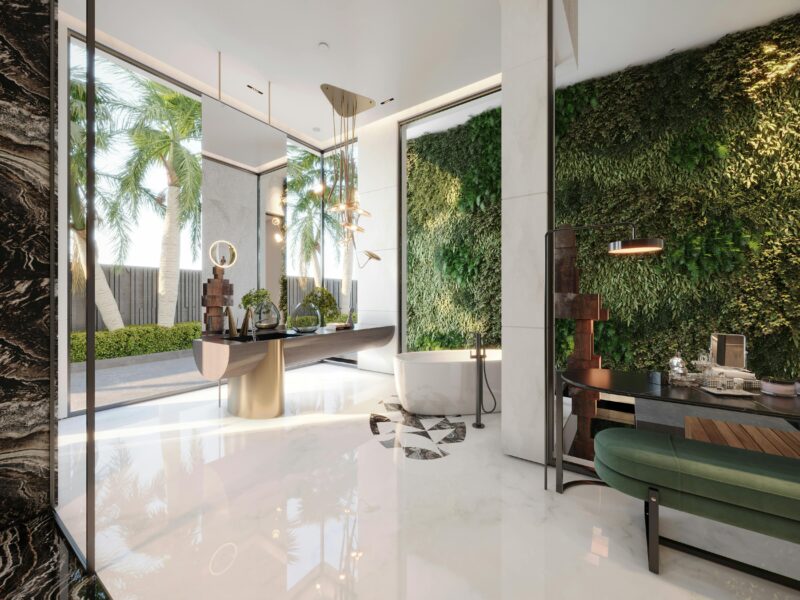 Luxurious modern green wall interior with a bathtub highlighting tropical elegance.