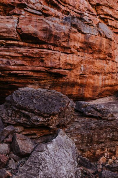 Explore the rugged beauty of a red rock canyon with dramatic textures and geological formations.