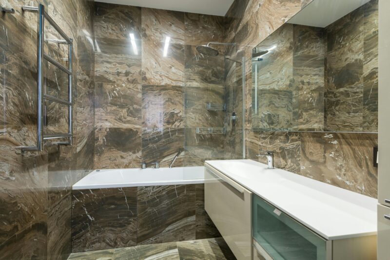 Elegant marble bathroom with sleek fixtures and modern design.