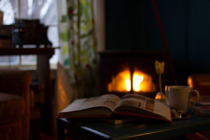 White book near mug in a cozy den.