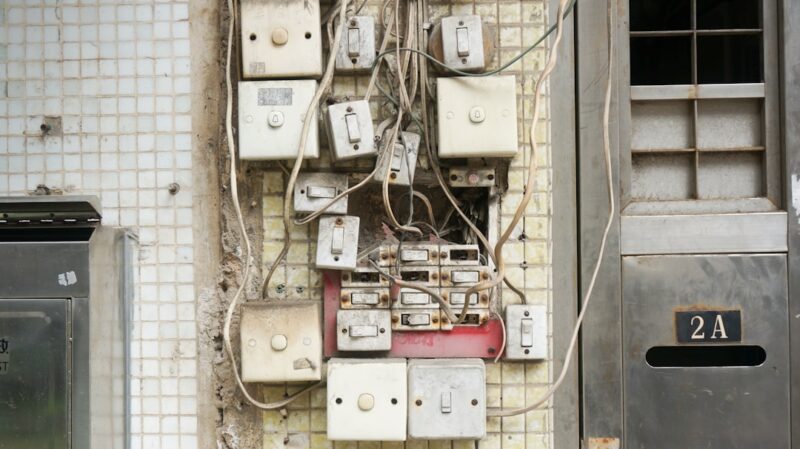 Several assorted power switches mounted on white wall.