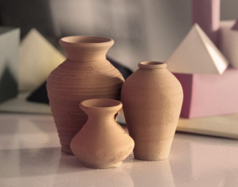 Three brown clay vases.