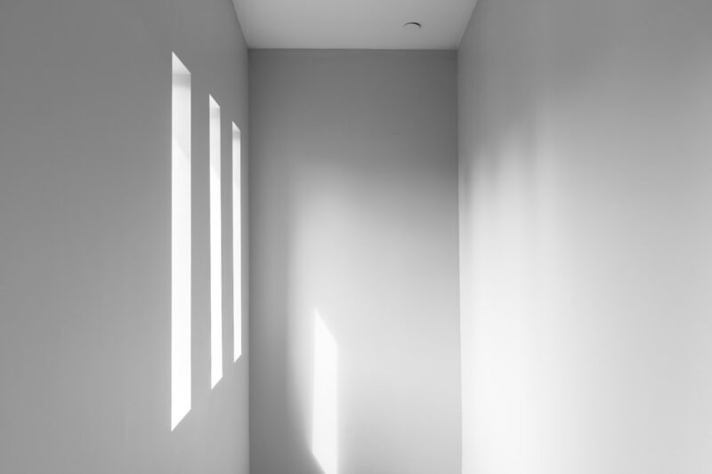 White empty hallway with soft lighting.