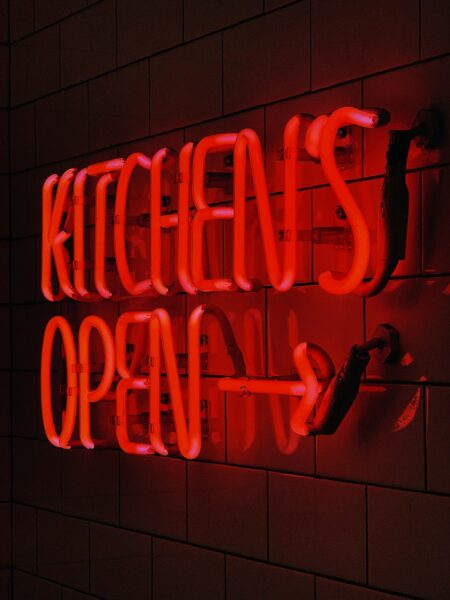 Kitchen's Open neon sign.