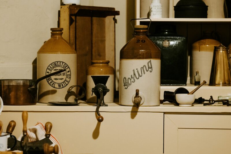 Victorian kitchen with white and brown earthenware jugs.