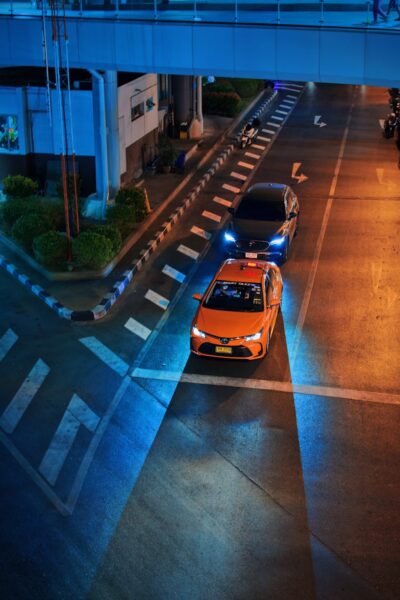 Yellow car on road during night time.