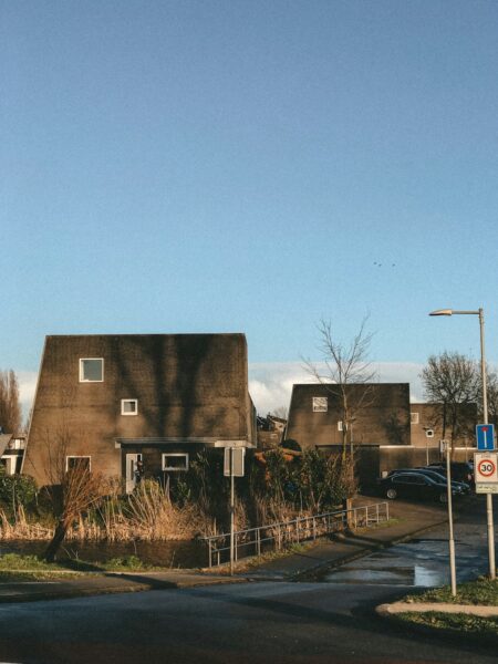 brown concrete building near green grass field during daytime