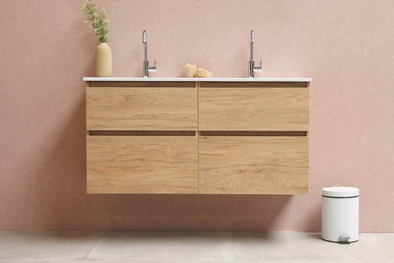 Brown wooden cabinet with stainless steel faucet.