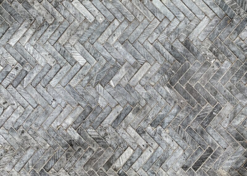 Herringbone tile pattern on floor.