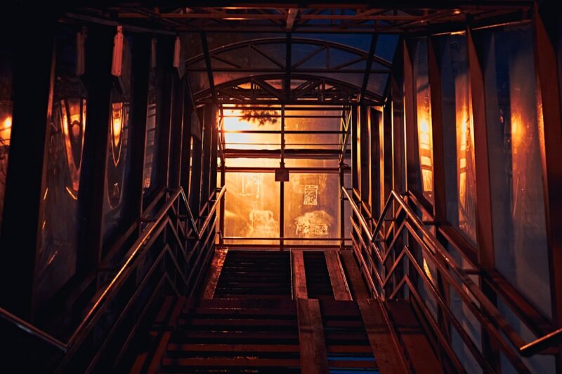 Brown wooden stairs with glass windows