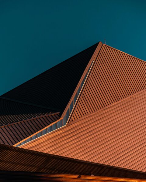 Brown concrete building under blue sky during daytime.