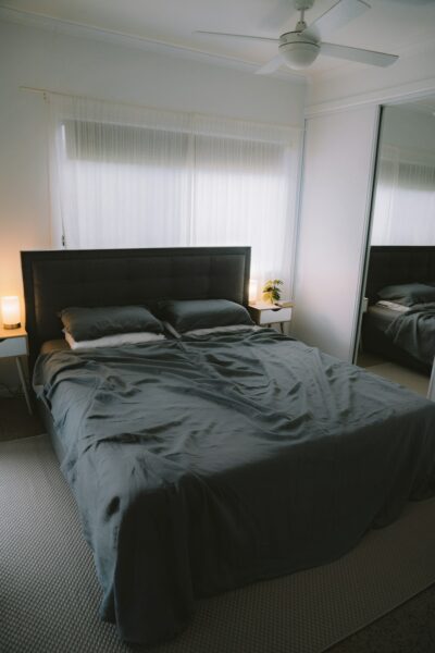 Black bed linen on bed