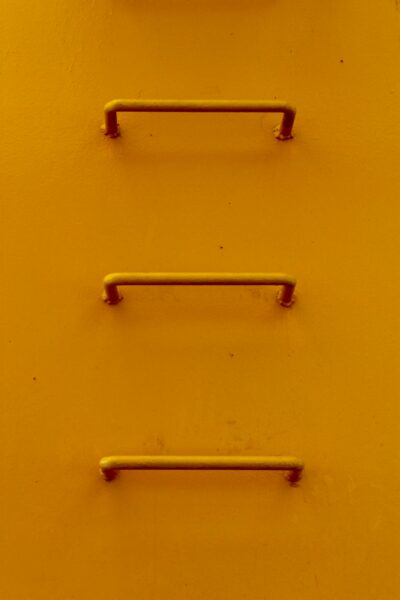 Yellow metal wall mounted rack