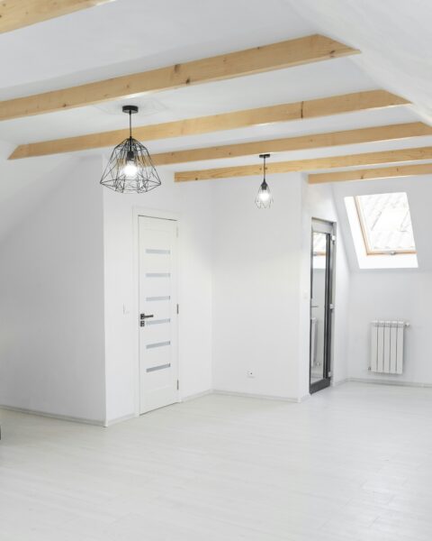 White wooden cabinet near white wooden door.
