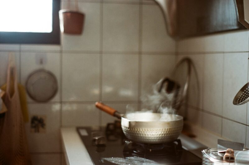 Stainless steel cooking pot on stove.