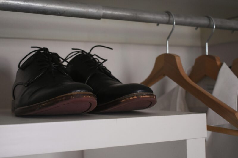Black and brown leather shoes neatly arranged