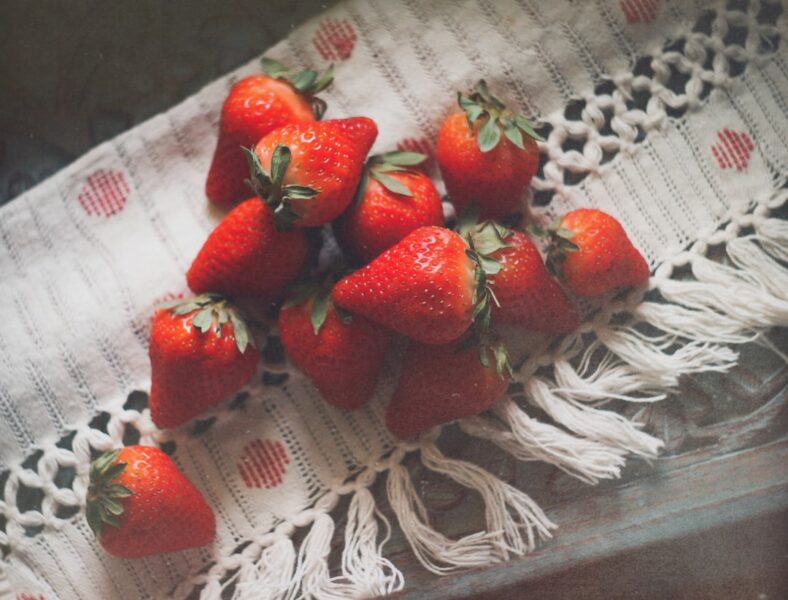 A bunch of strawberries sitting on top of a table