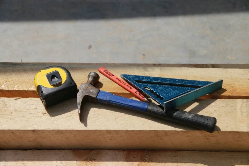 Black and yellow claw hammer.