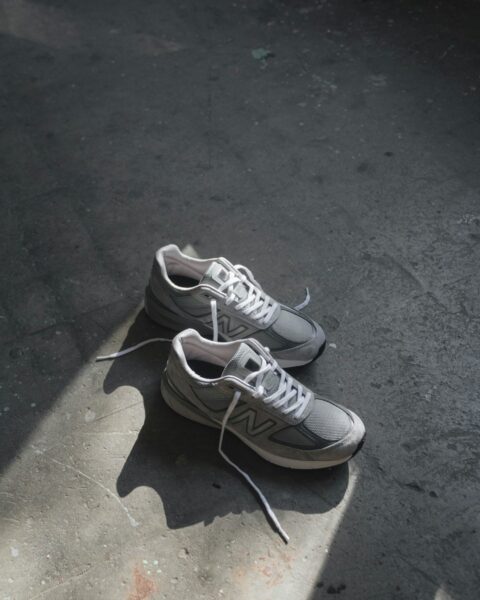A pair of New Balance shoes on the ground