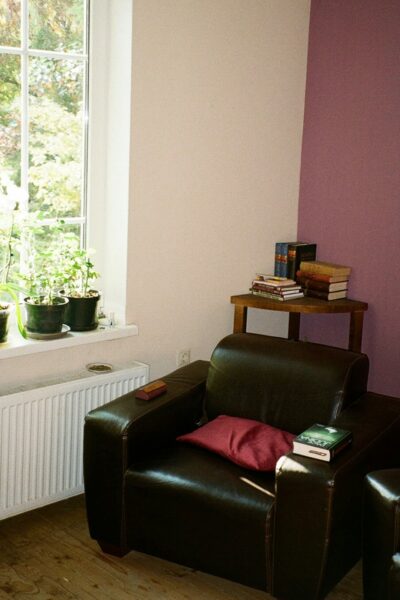 A living room with a chair and a radiator.