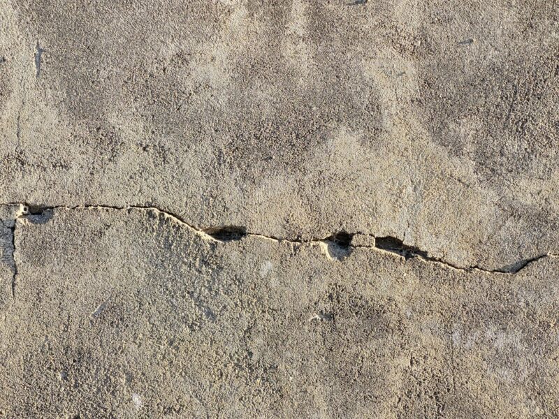 A close-up of a crack in a concrete wall