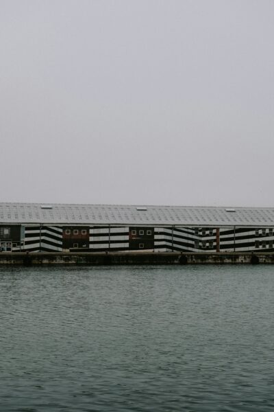 A large building sitting on top of a body of water.