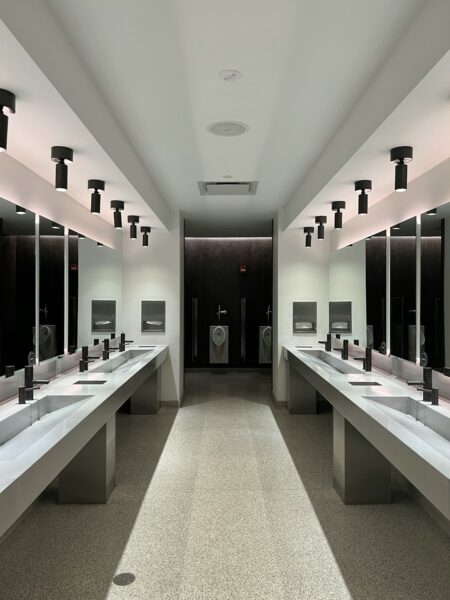 A large bathroom with sinks and mirrors