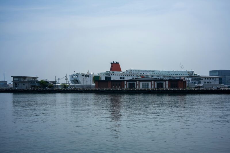 A large building next to a body of water.