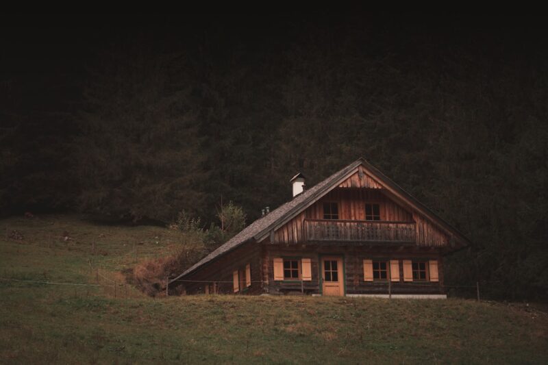 A house in a green field representing a classic European setting.