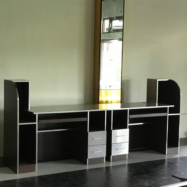 A room with a desk and a window