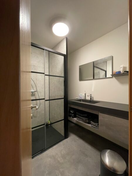 A bathroom with a glass shower
