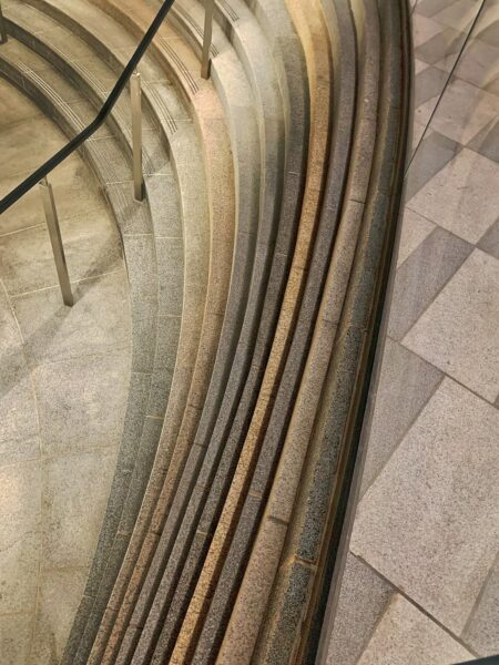 A close-up of a staircase showcasing intricate design work.