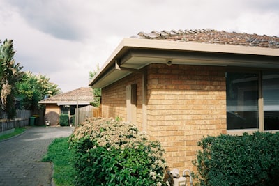 A house with a brick roof and a brick walkway