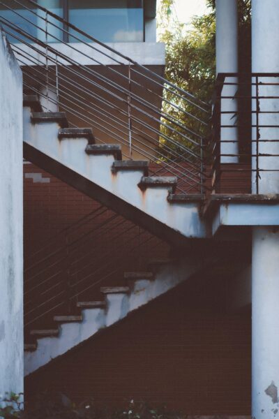 a fire hydrant in front of a set of stairs