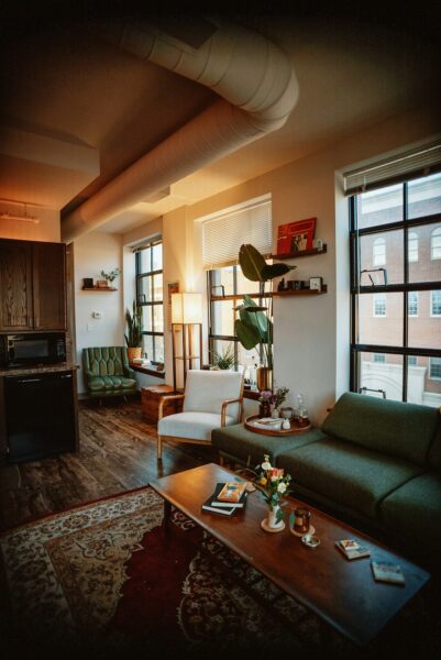 A living room filled with furniture and a large window.