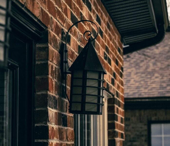 A brick building with a light on the side of it