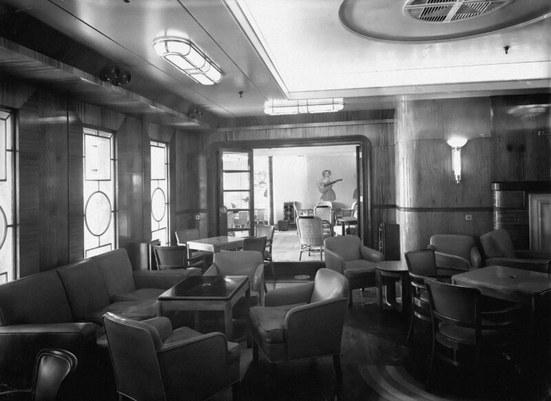 Passenger seating area on board TSS AWATEA in black and white