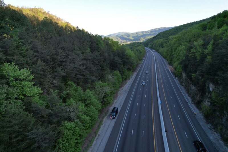 An aerial view of a highway in the mountains