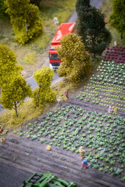 A model of a farm with a truck and people in it