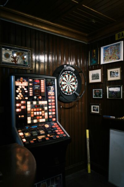 A dart board mounted to the side of a wall.