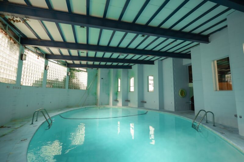 A large indoor swimming pool in a building.