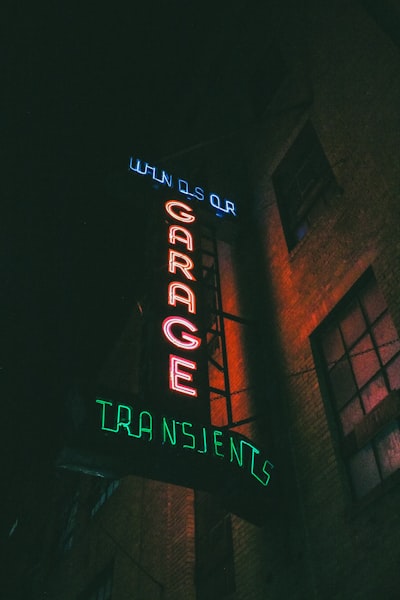 A neon sign on the side of a building