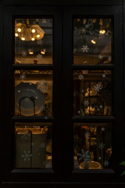 Window with snowflakes on the glass representing holiday theme