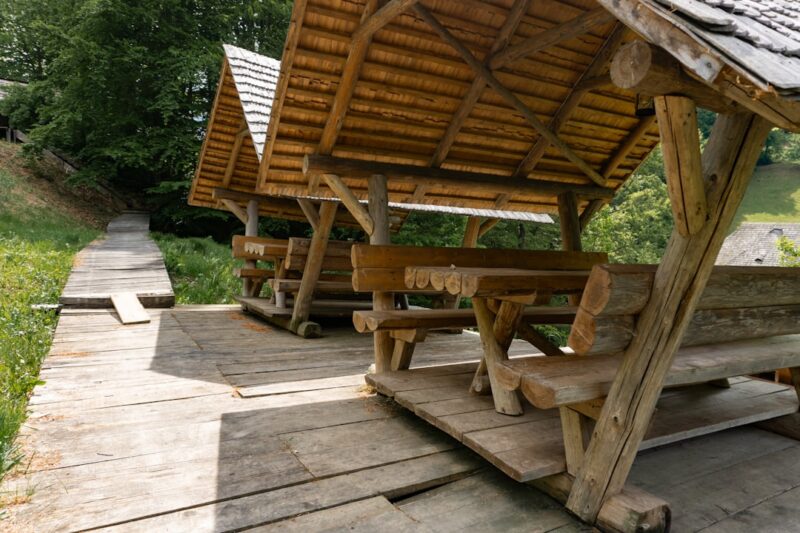 A group of wooden benches sitting next to each other