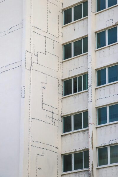 Tall white building with lots of windows